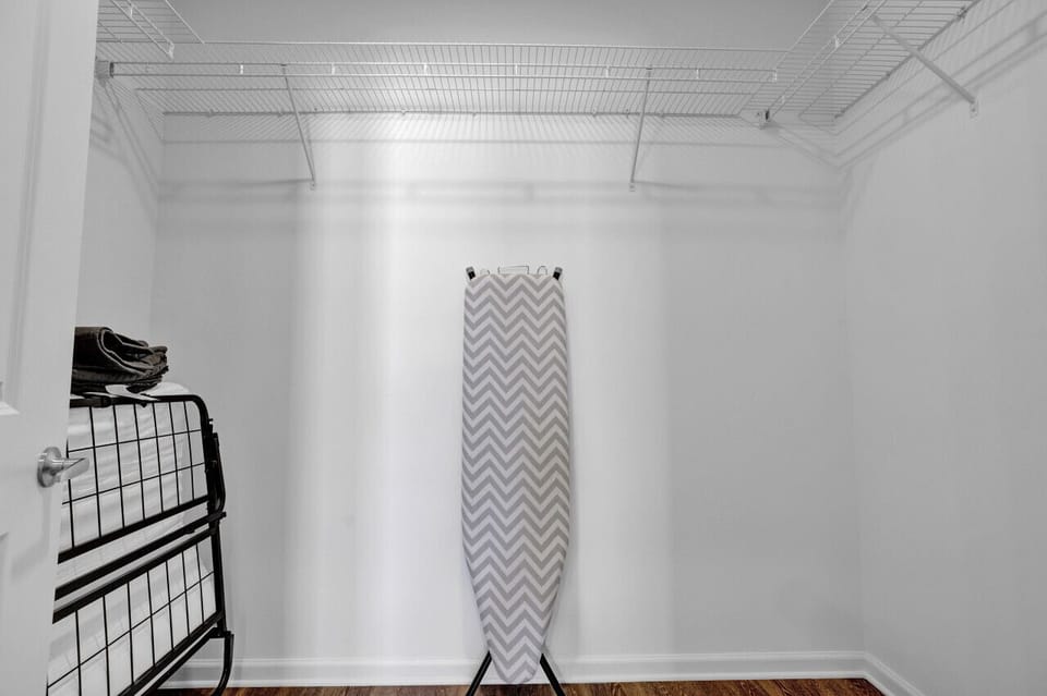 Minimalist iron stand, the perfect spot to hang clothes neatly and stay organized during your short-term rental stay.