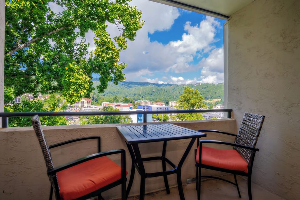 Step onto your private balcony and soak in stunning mountain views framed by lush greenery. Sip your morning coffee at the cozy bistro table as fresh air and peaceful scenery welcome your day.
