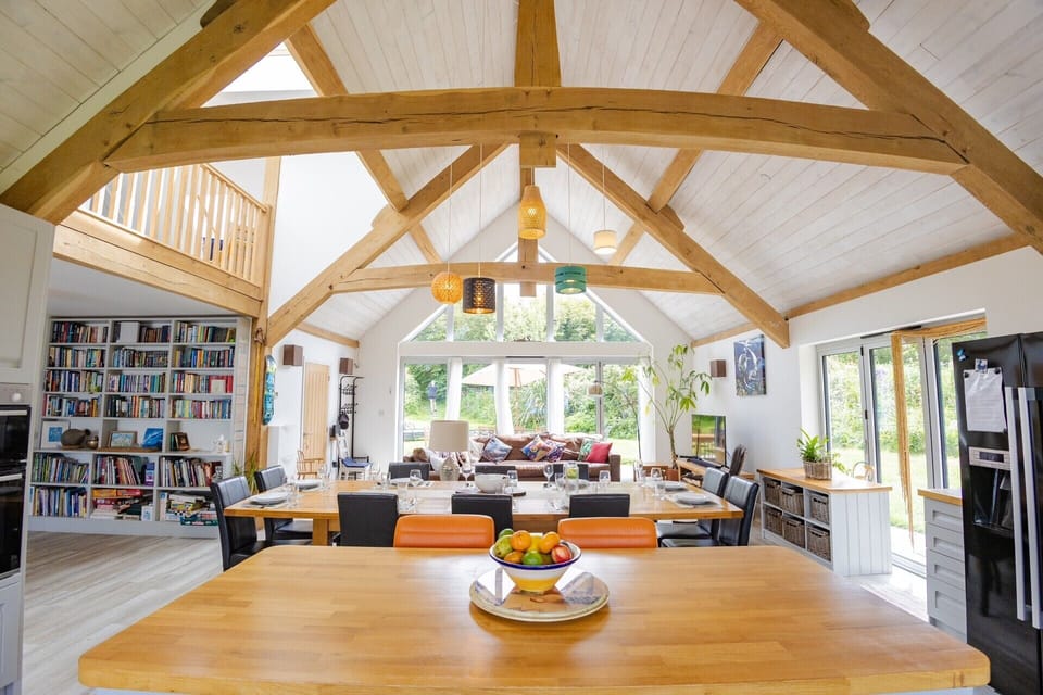 open plan living with oak frame and vaulted ceiling