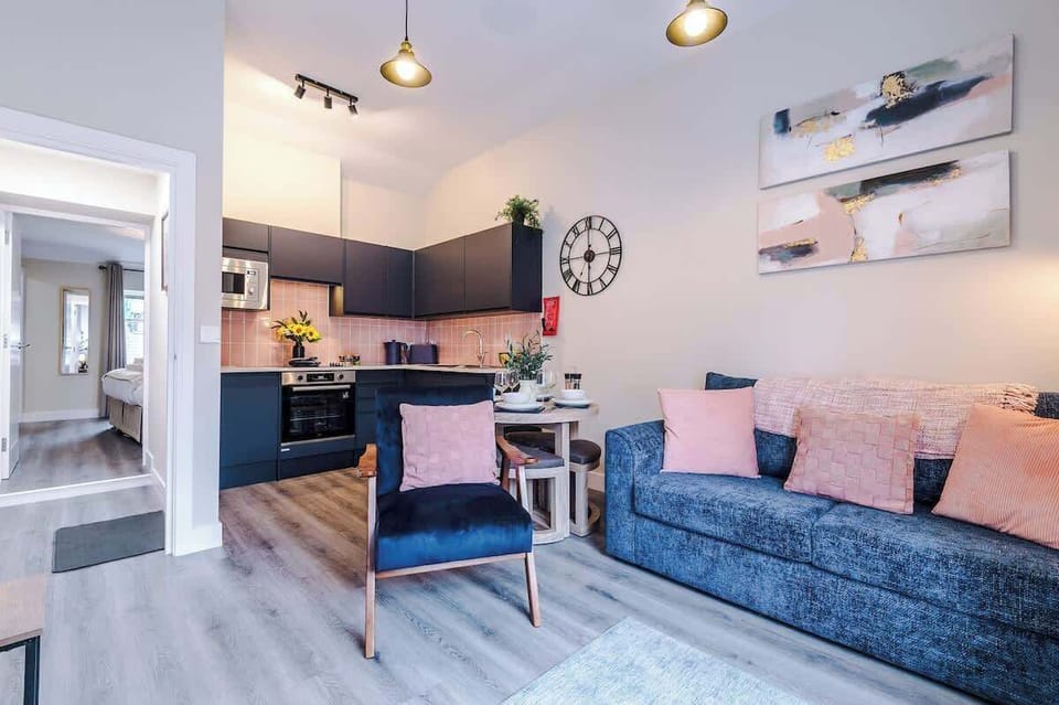 The spacious open-plan living space benefits from a double sofa bed, smart TV, dining area for 4 and a fully equipped kitchen.