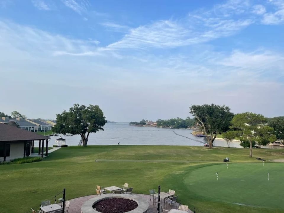 View of putting green and driving range from clubhouse restaurant patio. 
