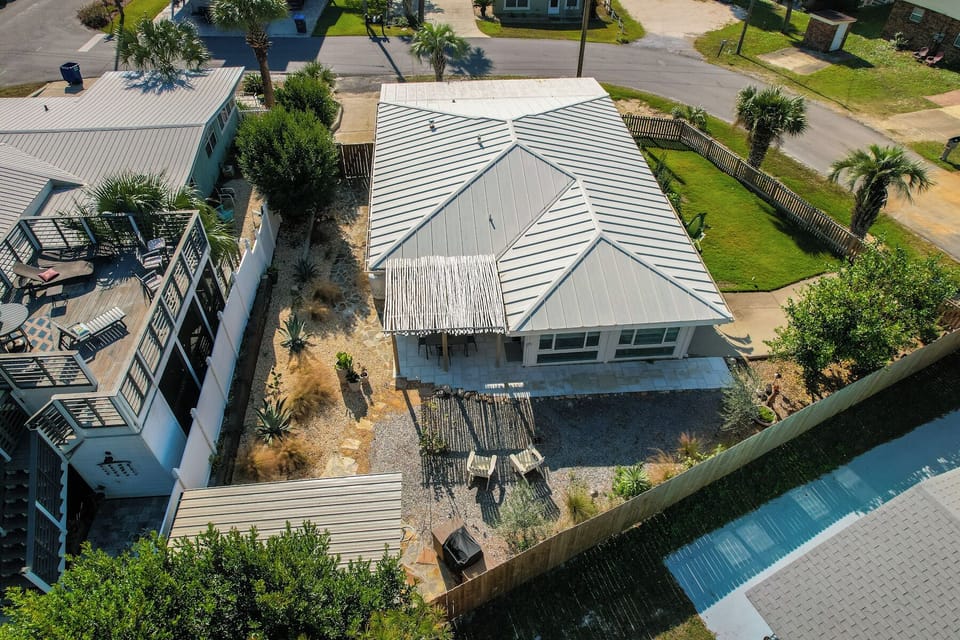 Fenced yard, patio w/table + 4 chairs, charcoal grill,  large yard for games