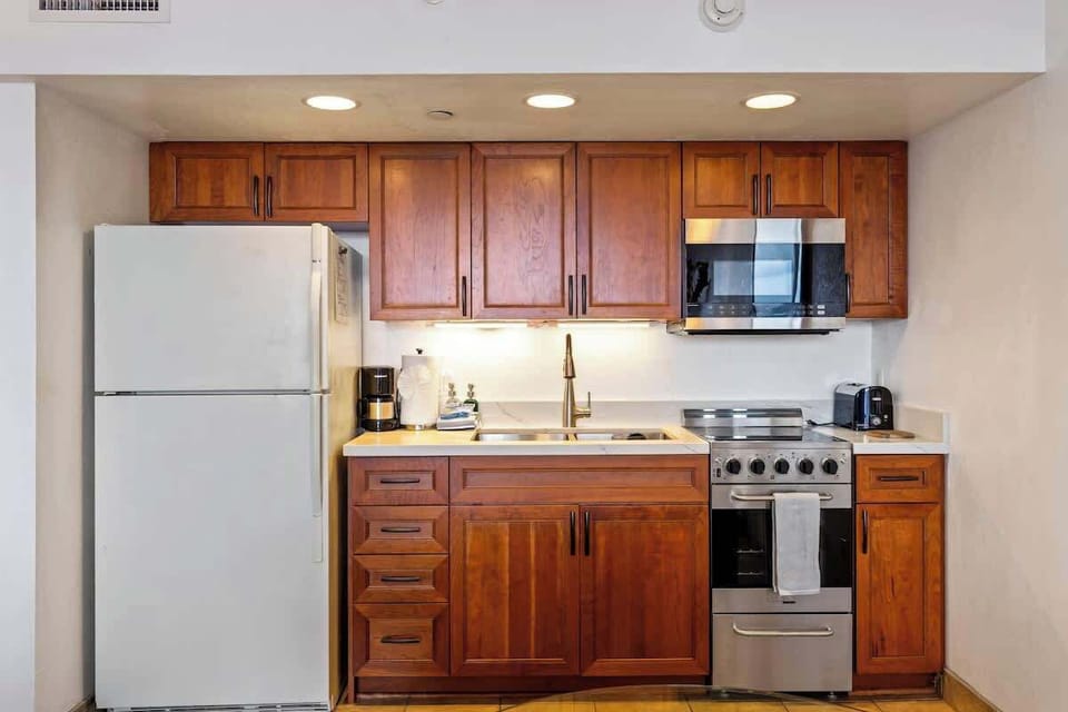 Kitchen features fridge/freezer, oven, microwave and all other needed small appliances to feel right at home