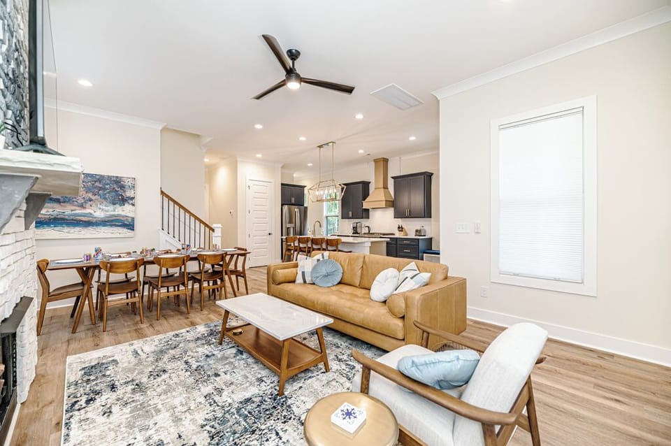 Main living room with kitchen in background