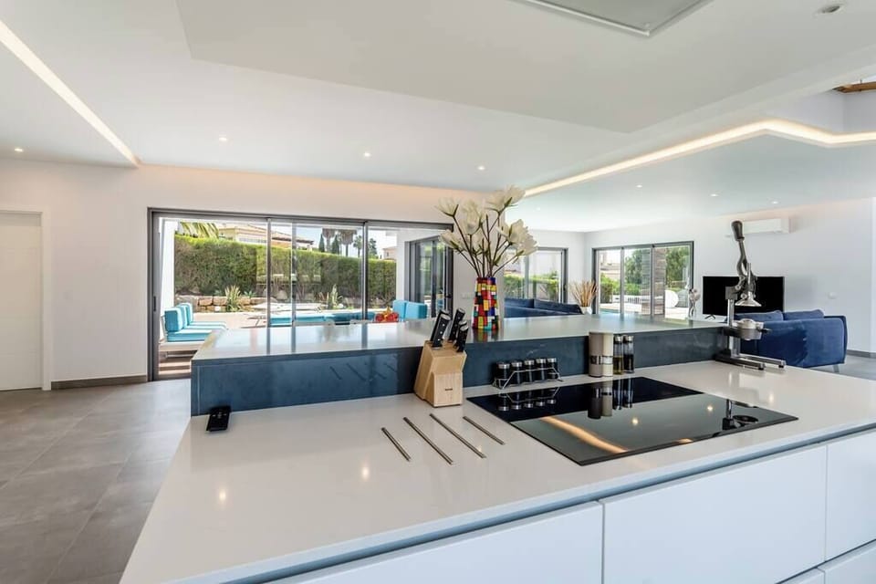 Open kitchen and living room at Villa Vogue by Indigo Algarve Villa Collection