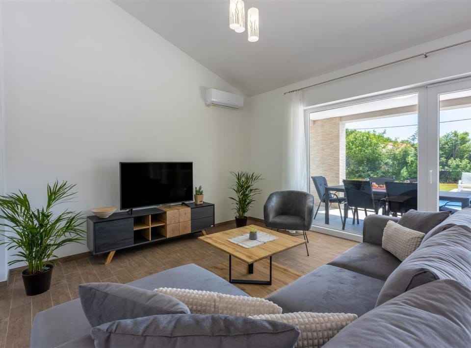 Villa (Three Bedroom Villa with Swiming Pool) | Living room | 32-inch flat-screen TV with satellite channels