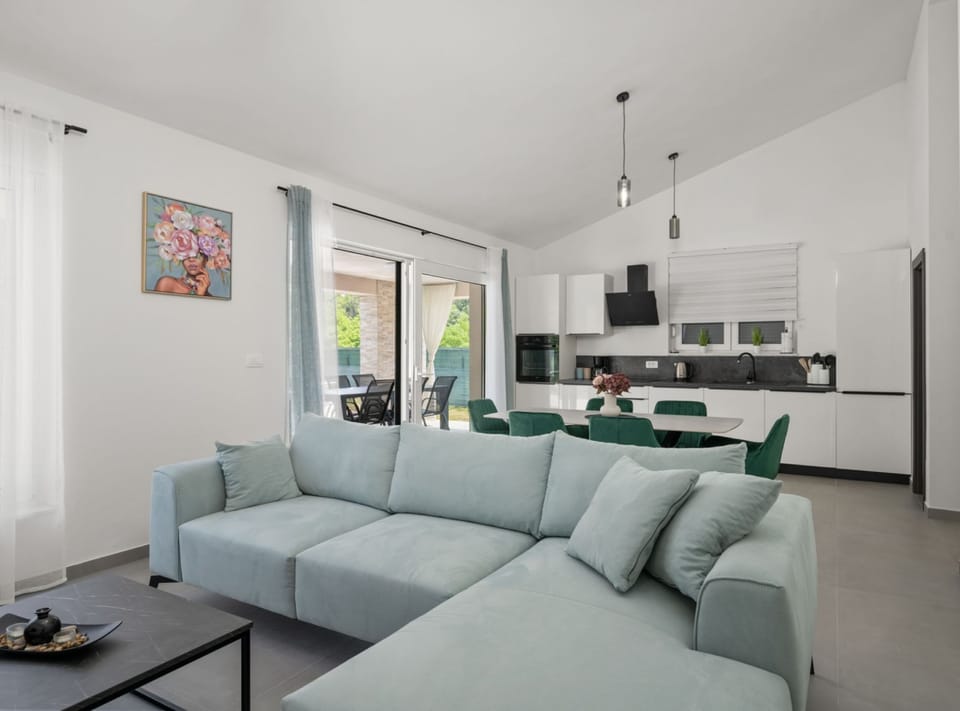 Villa (Villa SABINA - Santalezi - Three Bedr) | Living room | 32-inch flat-screen TV with satellite channels
