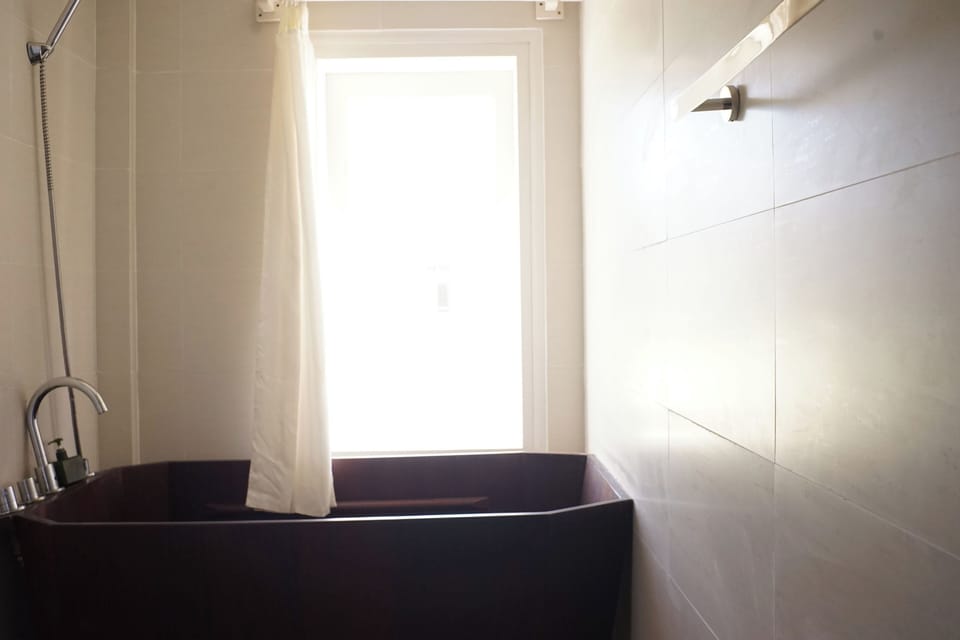 Deluxe Quadruple Room, Non Smoking | Bathroom | Rainfall showerhead, hair dryer, slippers, bidet