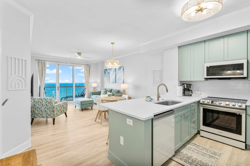 Fully equipped kitchen with quartz countertops and an extensive coffee setup for easy vacation mornings.
