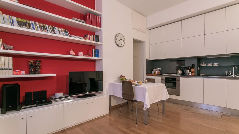 City Apartment | Living area | 37-inch flat-screen TV with digital channels