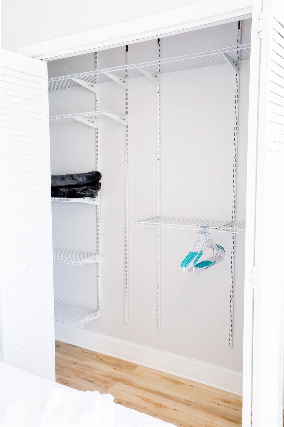 Hangers, extra blankets, and linens for the Murphy Bed are in the second bedroom closet