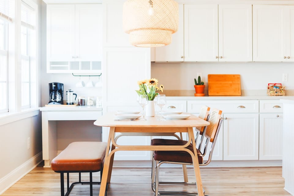 Dining table with seating for four. Plenty of space to enjoy a meal, play games, or work remotely