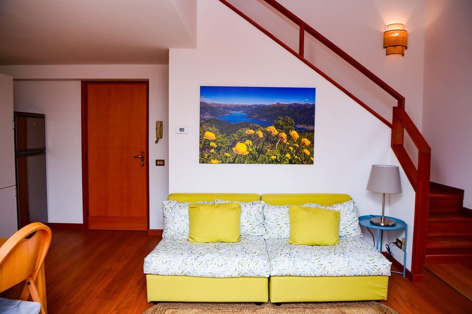 Apartment, Lake View | Living area | 35-inch TV with digital channels