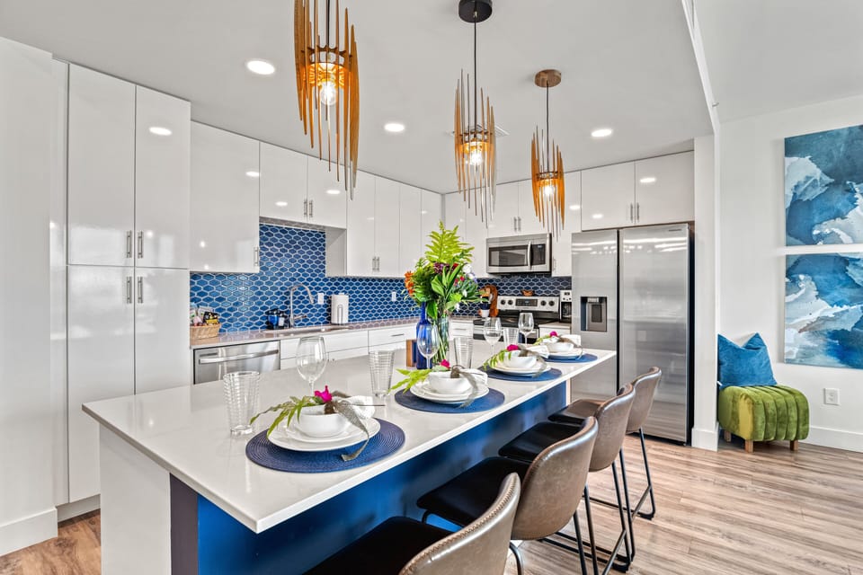 Well-Stocked Kitchen with Stainless Steel Appliances and Island Seating