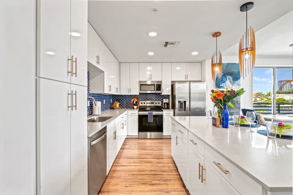 Well-Stocked Kitchen with Stainless Steel Appliances and Island Seating