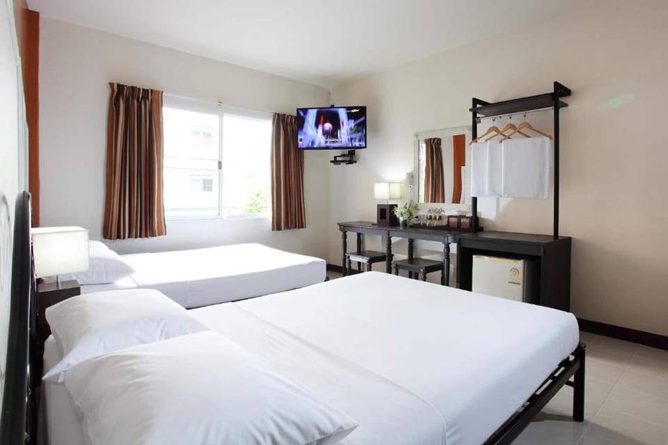 Deluxe Triple Room | In-room safe, desk, laptop workspace, blackout drapes