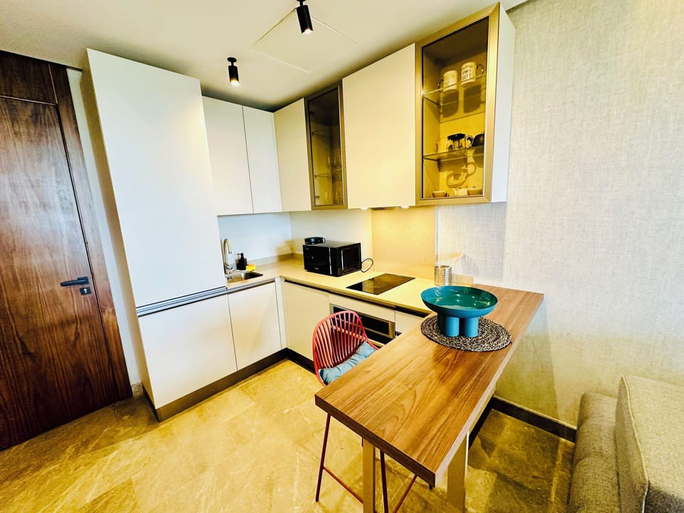 Luxury Apartment, Balcony, City View | Private kitchen | Espresso maker, coffee/tea maker, electric kettle, dining tables