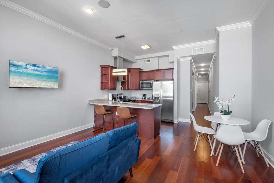  Kitchen and dining area with island seating and open layout offering functional entertaining space.