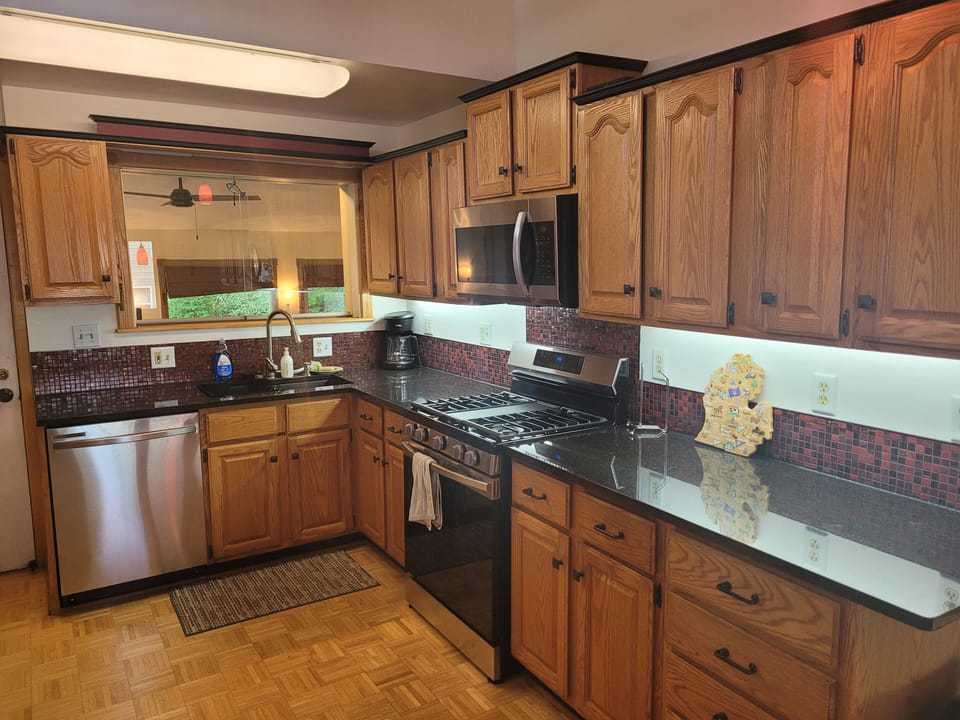 OVERALL:  The modern kitchen, with all appliances (including a dishwasher) and a good collection of cooking and dining supplies.