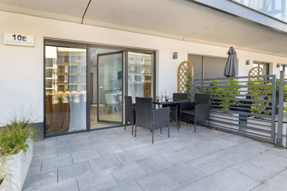 Spacious balcony with modern furniture, the perfect place for outdoor relaxation, with a view of the tranquil surroundings.
