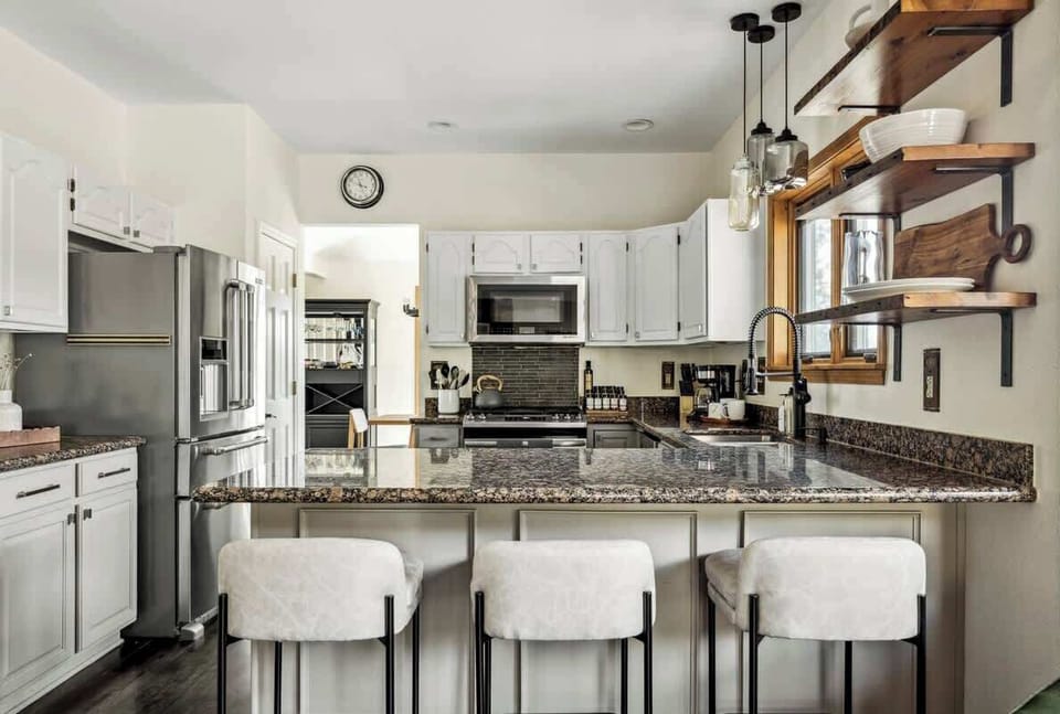 Open kitchen with bar-style seating