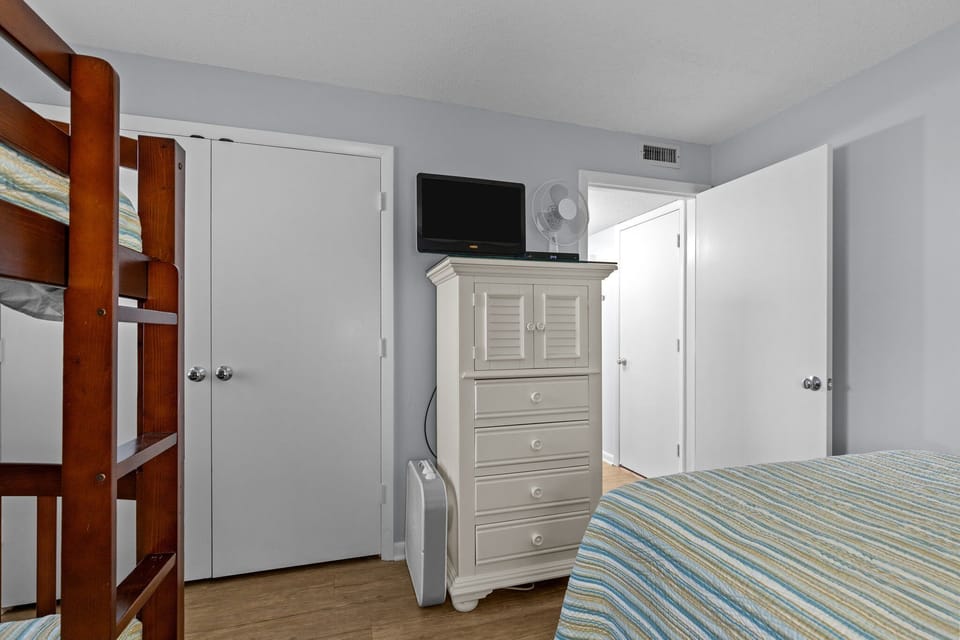 Your family bedroom features bunk beds and comfortable sleeping arrangements with entertainment and climate control for everyone's comfort.