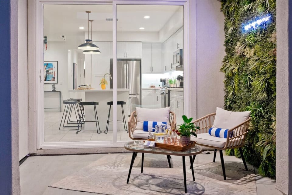 Charming Patio: Enjoy alfresco dining under the stars, surrounded by lush greenery and style!