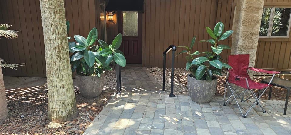 Great outdoor patio area, entrance to apartment.