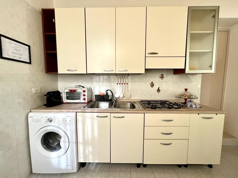 Comfort Apartment | Private kitchen | Full-size fridge, stovetop, electric kettle, cookware/dishes/utensils