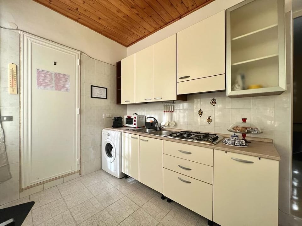 Comfort Apartment | Private kitchen | Full-size fridge, stovetop, electric kettle, cookware/dishes/utensils