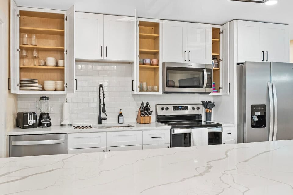 Cocoa Beach Kitchen | Breezy Coastal Retreat Featuring Subway Tile, Open Storage & Effortless Function