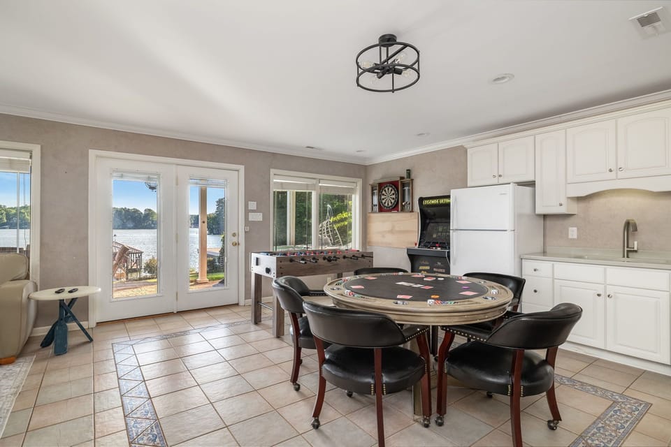 Poker table, foosball, karaoke, dart board, books, board games, hot tub outside