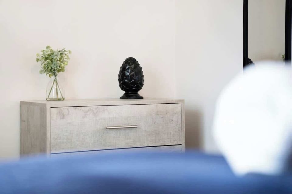 A practical and comfortable bedroom with a double bed, ample storage space, and the option to convert into twin single beds when needed.