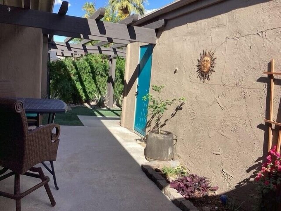 Pergola connects front entry door and garage entry.