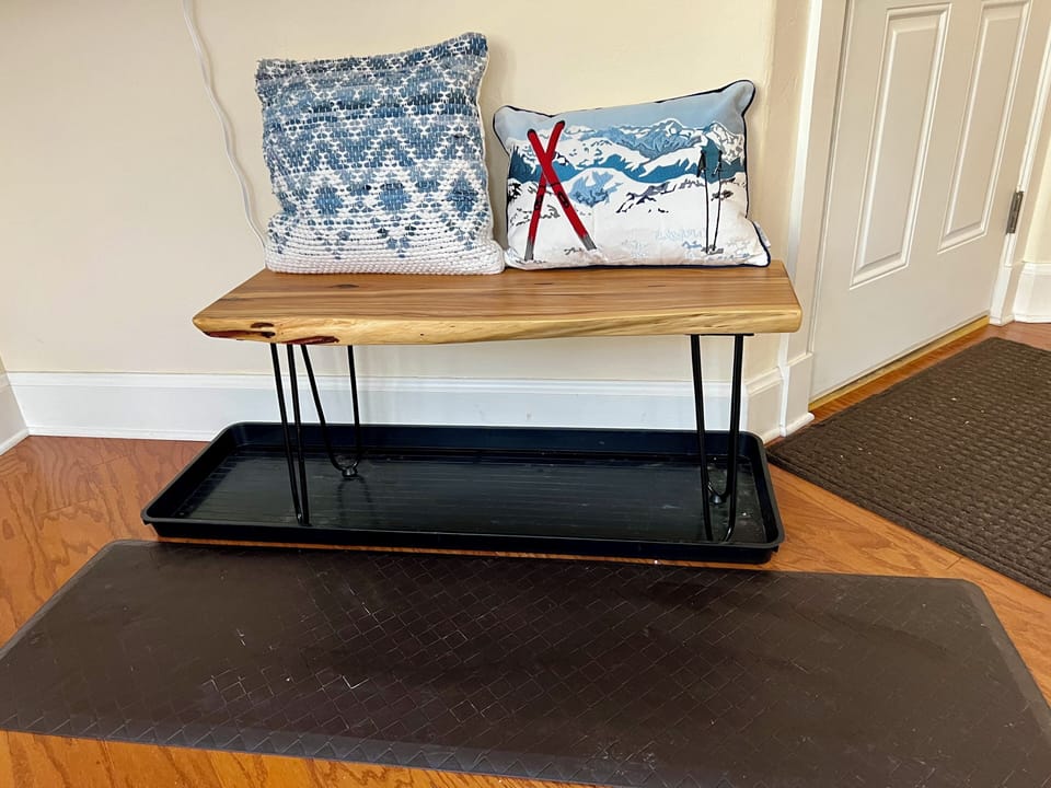 Entryway bench with boot mat