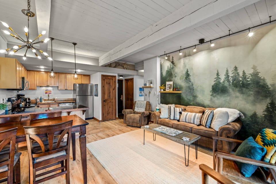 Inviting open-concept design featuring a connected living, dining, and kitchen space perfect for relaxing or entertaining.
