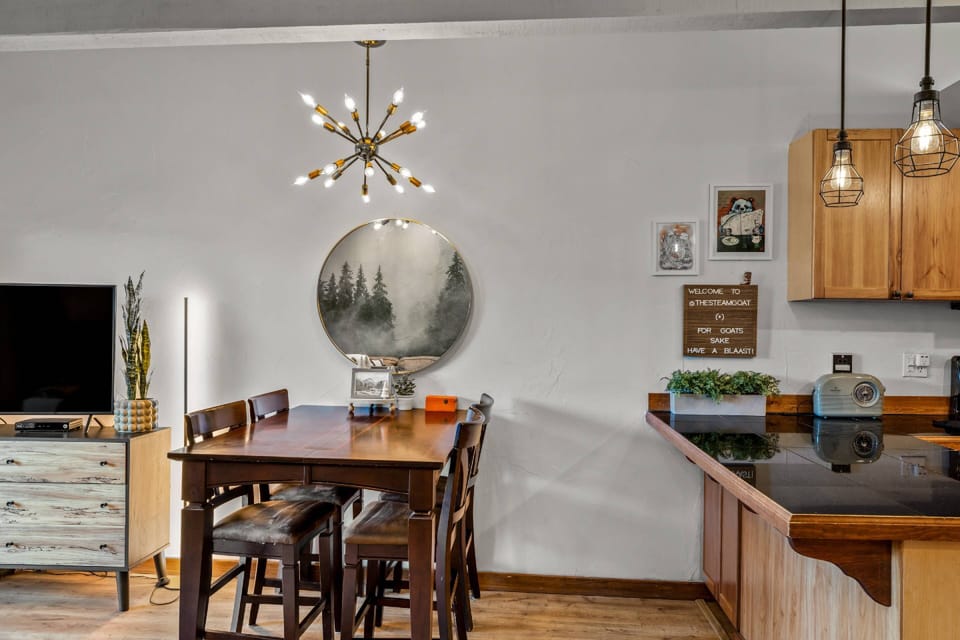 Enjoy a warm, compact dining space steps from the kitchen—ideal for casual meals or game nights.