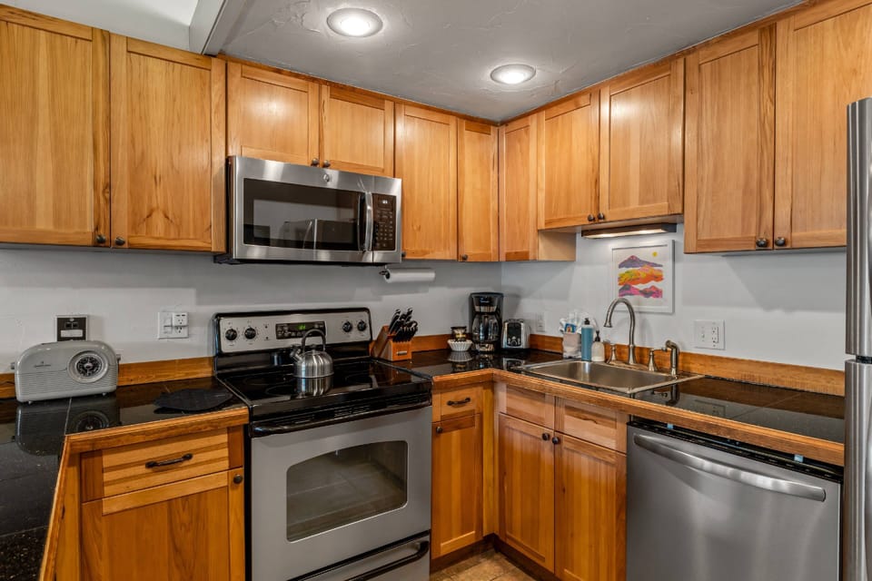 Fully equipped kitchen with plenty of counter space and natural light.