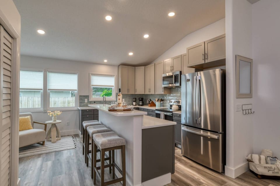 Grab a stool to enjoy a meal or relax in the cozy corner of this brand new kitchen!
