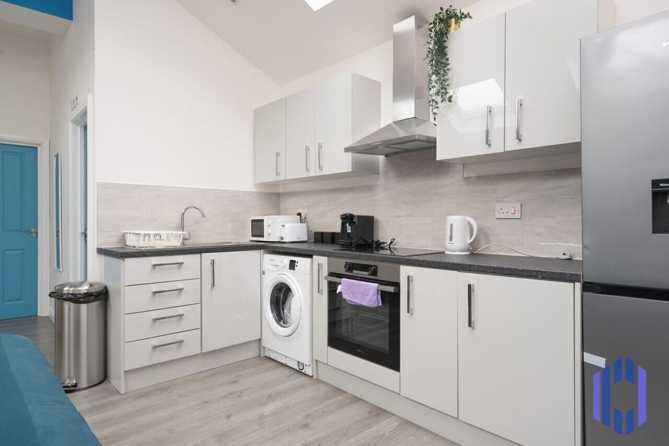 Kitchen. Fully equipped with cooking equipment perfect for families. Appliances such as fridge freezer, microwave, cooker, oven, dishwasher Toaster are free and available for your use.