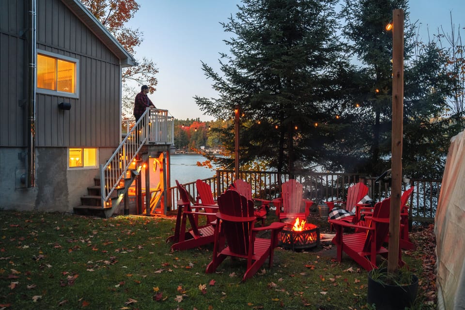 Fire Pit with Brand new Muskoka Chairs, Fire Pit and String Lights. 
