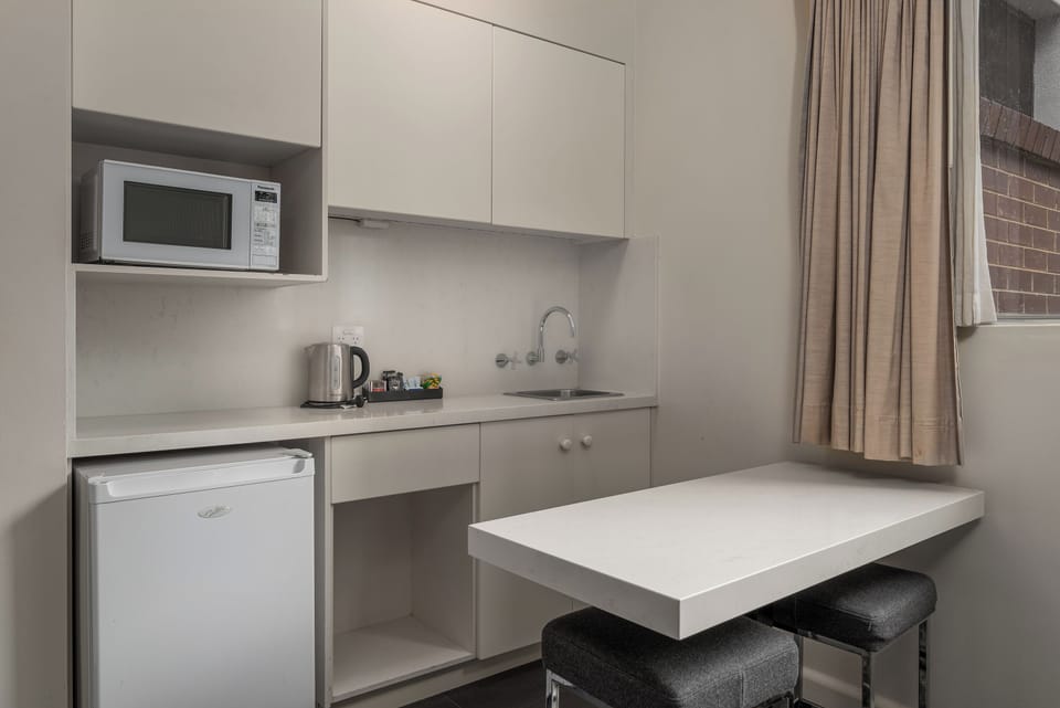 Triple Studio | Private kitchen | Mini-fridge, microwave, coffee/tea maker, electric kettle