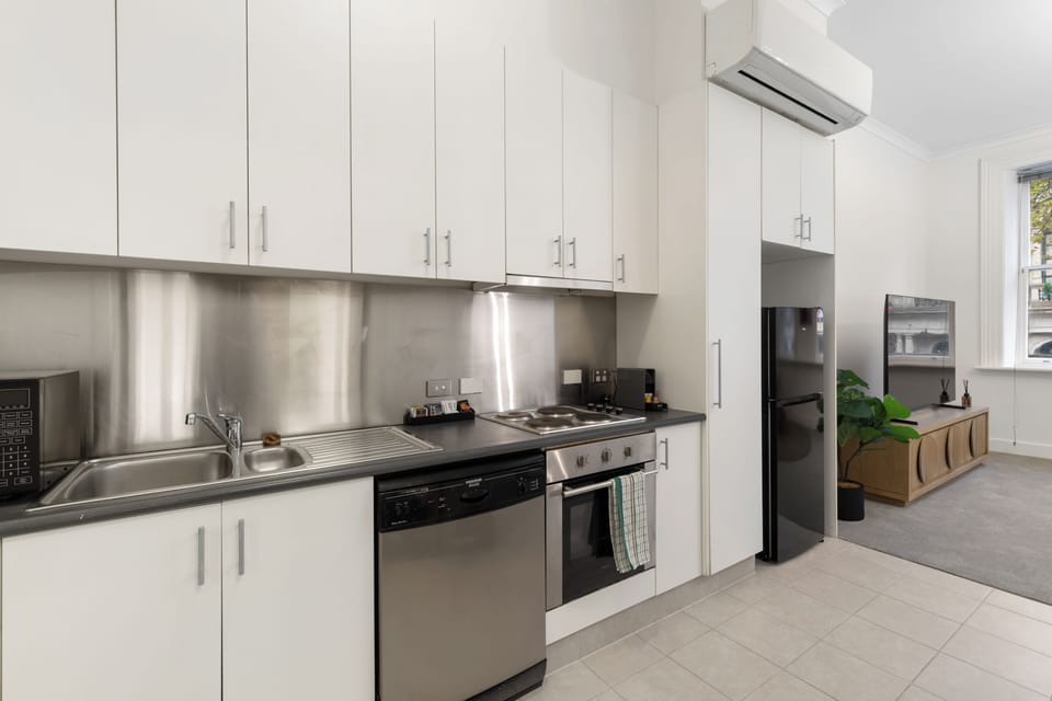 Deluxe Apartment, 2 Bedrooms | Private kitchen | Fridge, microwave, stovetop, dishwasher