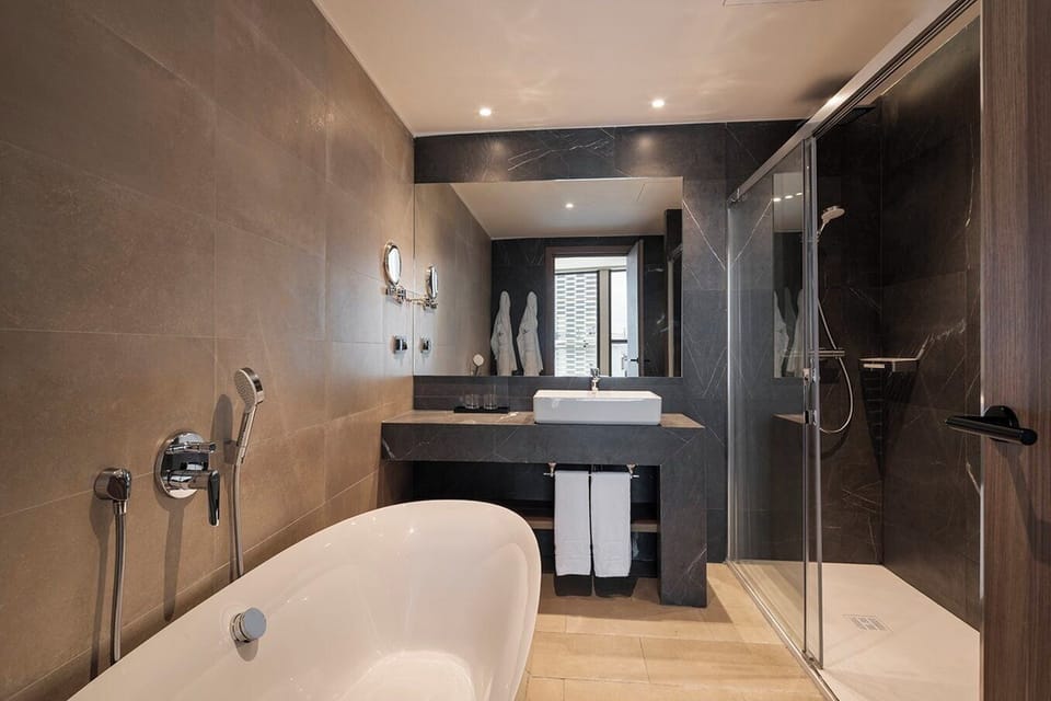 Eco-friendly toiletries, hair dryer, bidet, towels