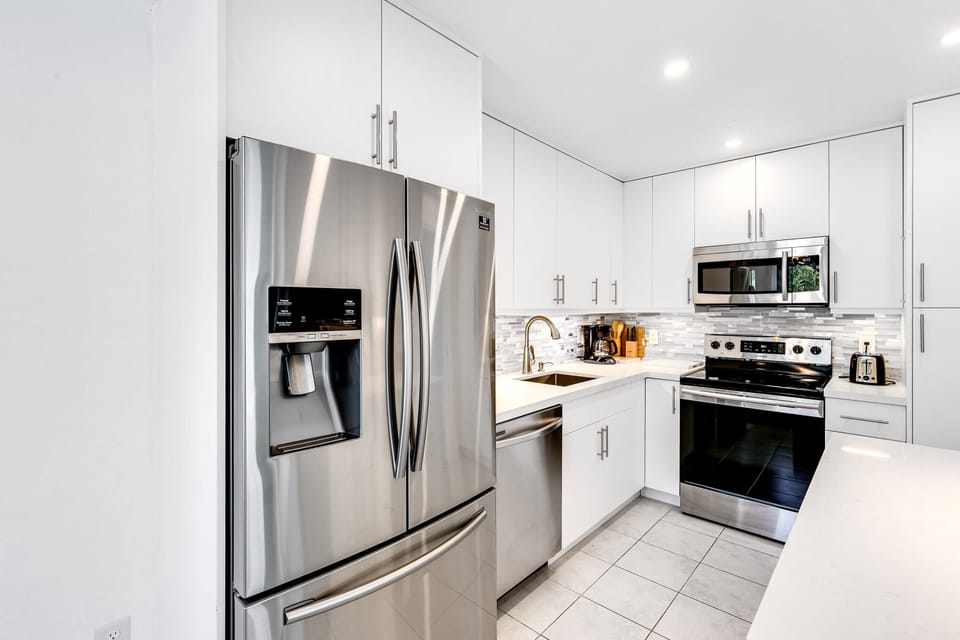 Closed shelves in the kitchen give a clean, uncluttered look.