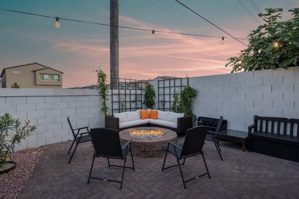 Relax around the cozy fire pit in our charming backyard seating area