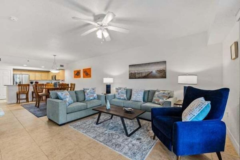 Bright and inviting gathering area featuring comfortable furnishings and an open layout designed for family and friends.