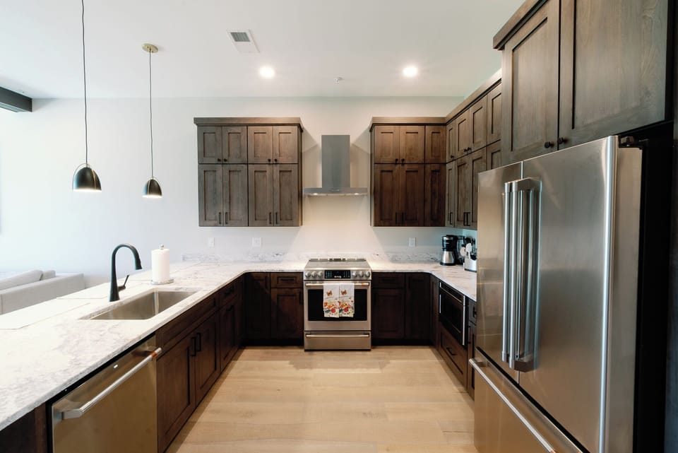 Fully Stocked Kitchen With Custom Cabinets & Stainless Steel Appliances
