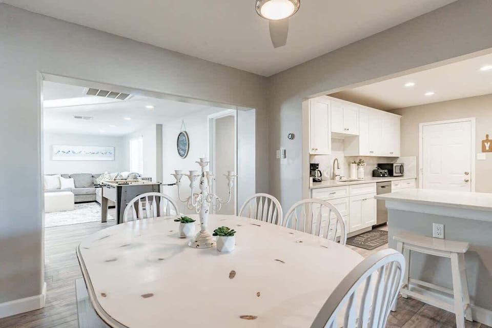 Dining spaces to sit for a meal together next to the kitchen Island for additional seating and next to the 2nd living room area/ game room. Great for entertaining! 