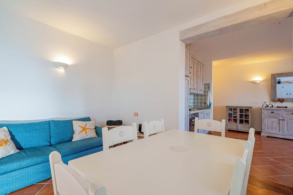Apartment, Sea View | Living area | 35-inch TV with digital channels